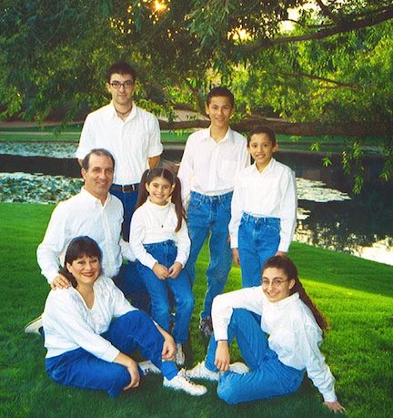 Economides Family 2003 in blue jeans at a lake.