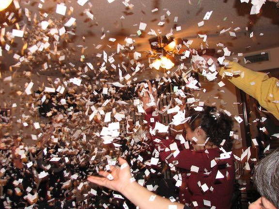 Throwing confetting on New Years Eve.
