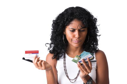 A woman trying to decide which credit card to pay-off first