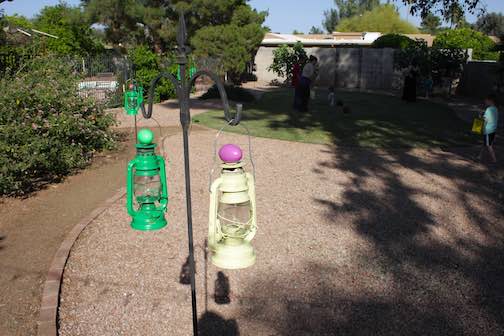 Plastic easter eggs on outdoor lanterns.