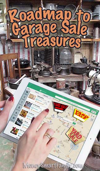 A woman's hands using a map to find garage sales.