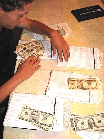 Joe managing his budget with cash envelopes