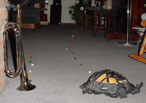 A jellybean trail started by a trumpet and a catchers mask.