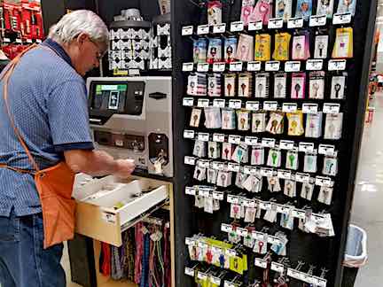 Home Depot employee making a duplicate key for me.