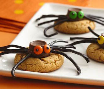 Halloween spider cookies with licorice legs.