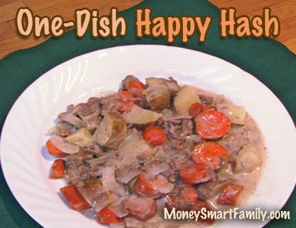 Ground beef hash served on a white plate with carrots and potatoes.