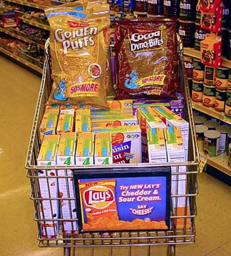 Grocery cart full of discounted cereal.