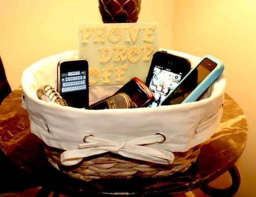 Cell phones stored in a basket from http://sarahontheblog.blogspot.com/